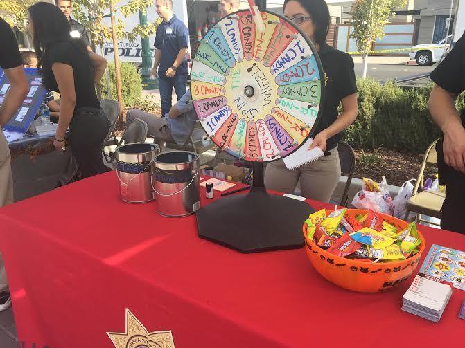 At this table, participants spin the wheel and are asked a safety awareness question. If they get the question right they can win their prize on the wheel.&#160;