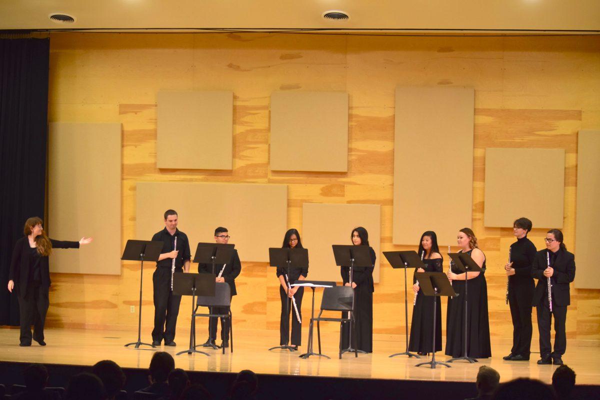 In this photo, Dr. Dennis acknowledges the Flute Choir after their performance.&#160;