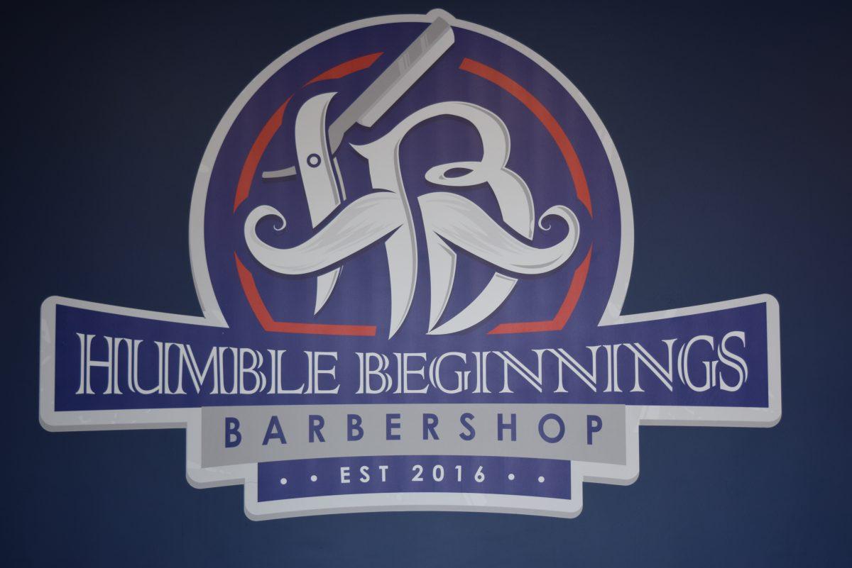 The Humble Beginnings Logo that is on one of their walls inside their barbershop.&#160;