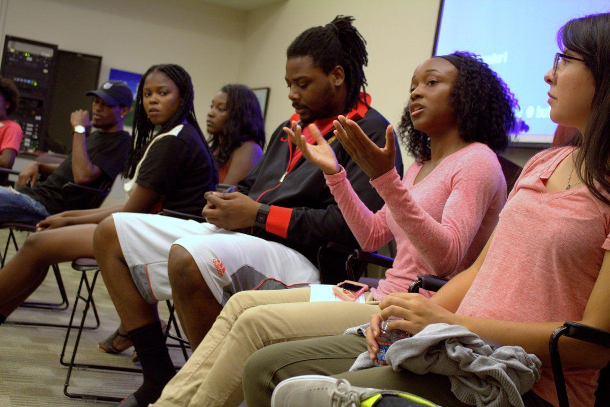 Michelle Akanji (senior, Kinesiology), vice president and treasurer of the Black Student Union, leading a discussion at a meeting. (The Signal/Tatiana Olivera)