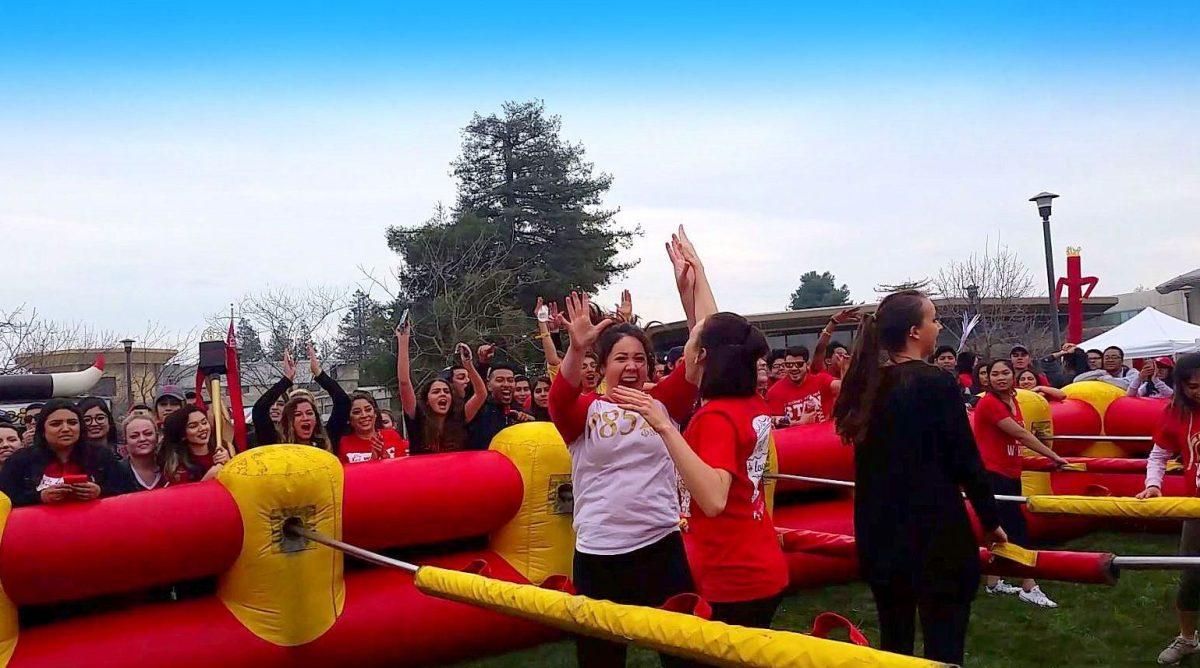 Members of Phi Mu celebrating after scoring a goal during a game of human foosball. (Signal Photo/Tatiana Olivera)