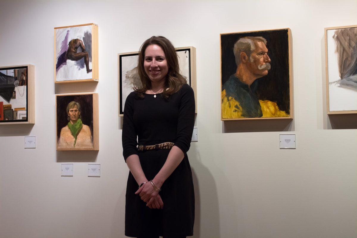 Artist Louisa Benhissen standing in front of her art at her exhibit "Social Landscapes in California and Other Works" at Art Space on Main. (The Signal/Tatiana Olivera)