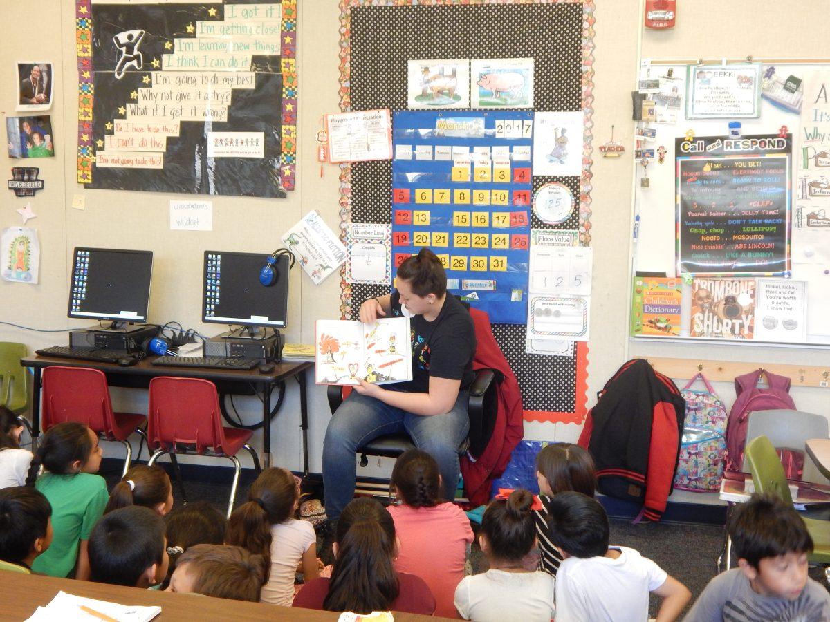 Stan State student Kari Cherry reading to a 4th grade class on Mar. 2 for Read Across America at Wakefield Elementary School. (The Signal/Vanessa Olmos)