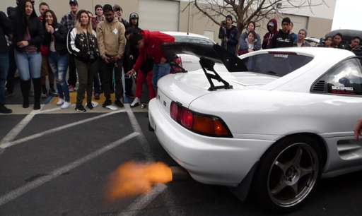 Bystanders crowd around this flame spitting 1993 Toyota MR2 Turbo&#160;while taking part of a rev off competition. (Photo Courtesy of Andrew Cabrera)