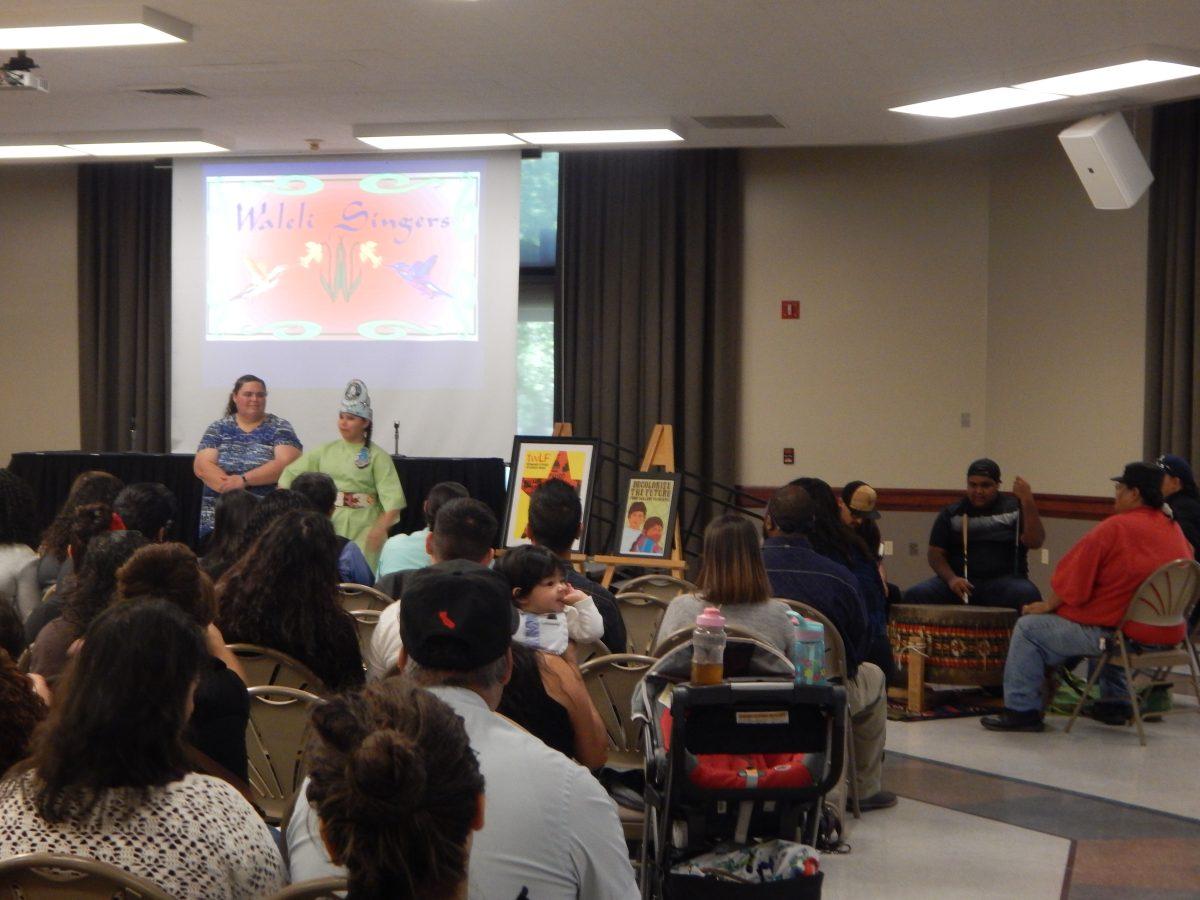 The Hummingbird Waleli Singers talking to the audience at the Ethnic Studies Conference on Mar. 31 and the drummers are on the right side. (Signal Photo/Francely Santos)