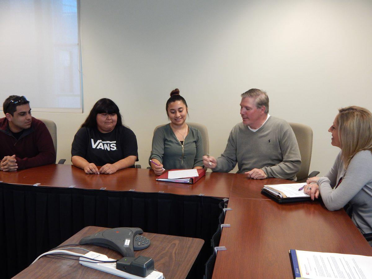 <p>From right: Jason Serang, Gabriela Aguayo, Gloria Vallin, Matthew Lopez Phillips, and Janice Curtin during a meeting about the CSU immigration policy. (Signal Photo/Clara Zapien)</p>