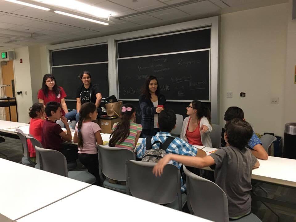 Members of the Sociology Club rewarding one other student for winning a game of "zingo". The goal of the game is to identify a&#160;picture and say it aloud.&#160;(Photo Courtesy of Lexi Lucero)