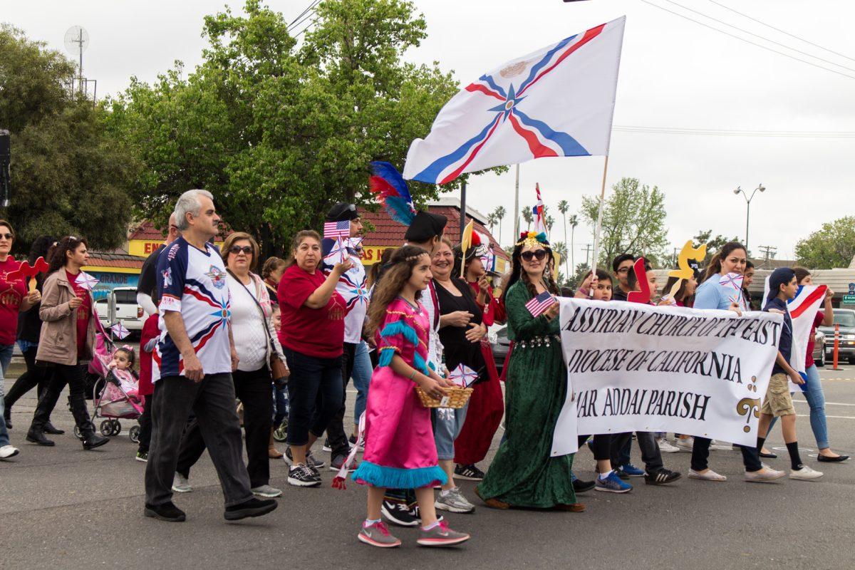 Mar Addai Assyrian Church of the East parish parading on Broadway Avenue in downtown Turlock to celebrate the new year. (Signal/Mario Muniz)