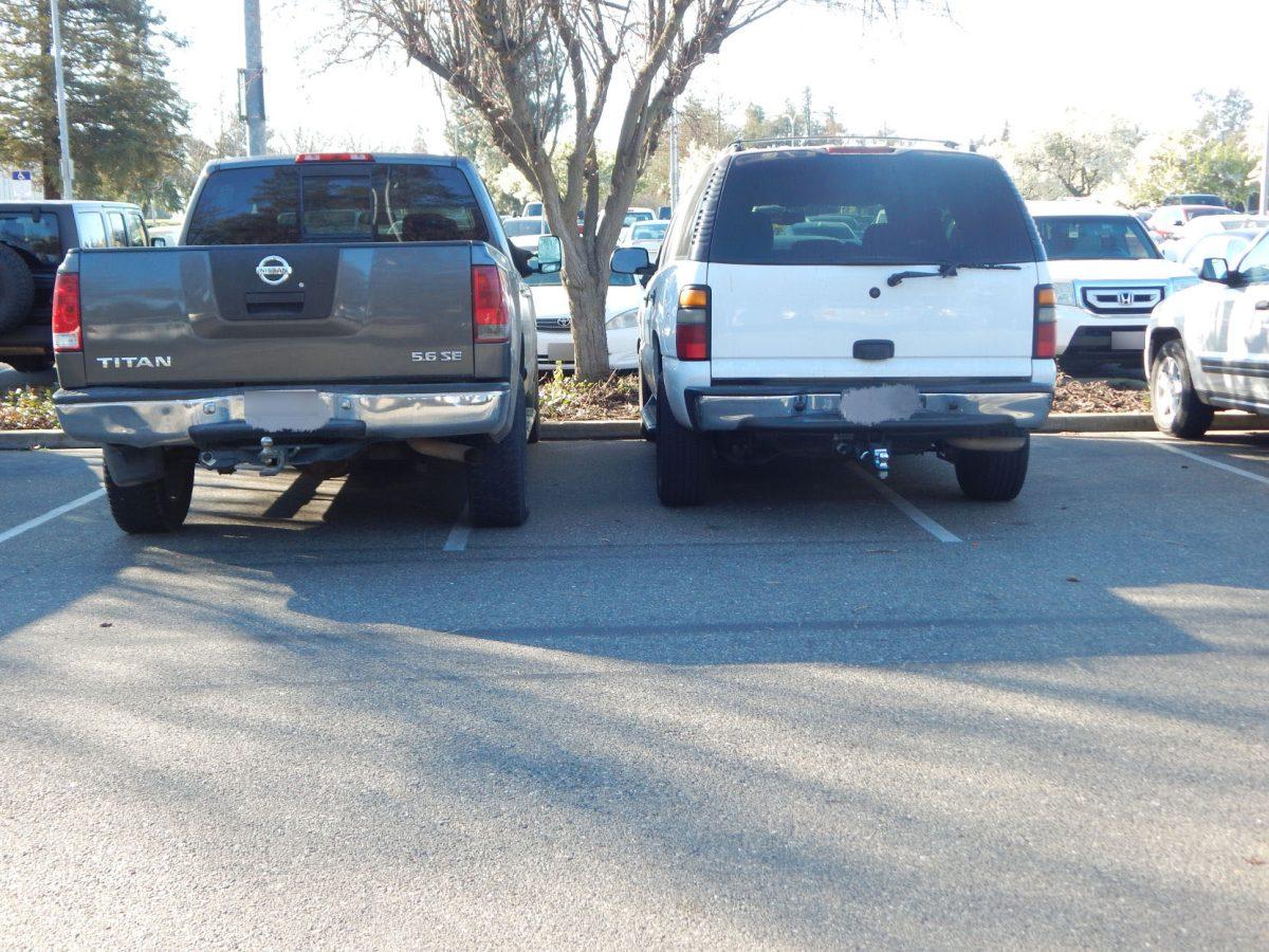 A truck and a car parked incorrectly. (Signal Photo/Megan Lavilla)