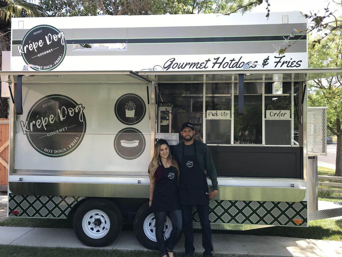 <p>Eileen and Jorge Rodriguez in front of their food truck: Krepe Dog. (Photo courtesy of Eileen Rodriguez)</p>