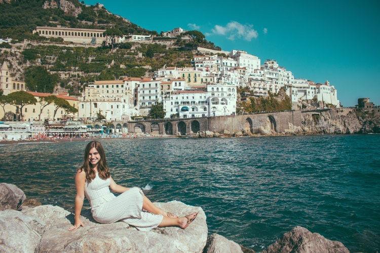 Mallory Melo poses in front of the beautiful Italian scenery. (Photo courtesy of Savannah King)