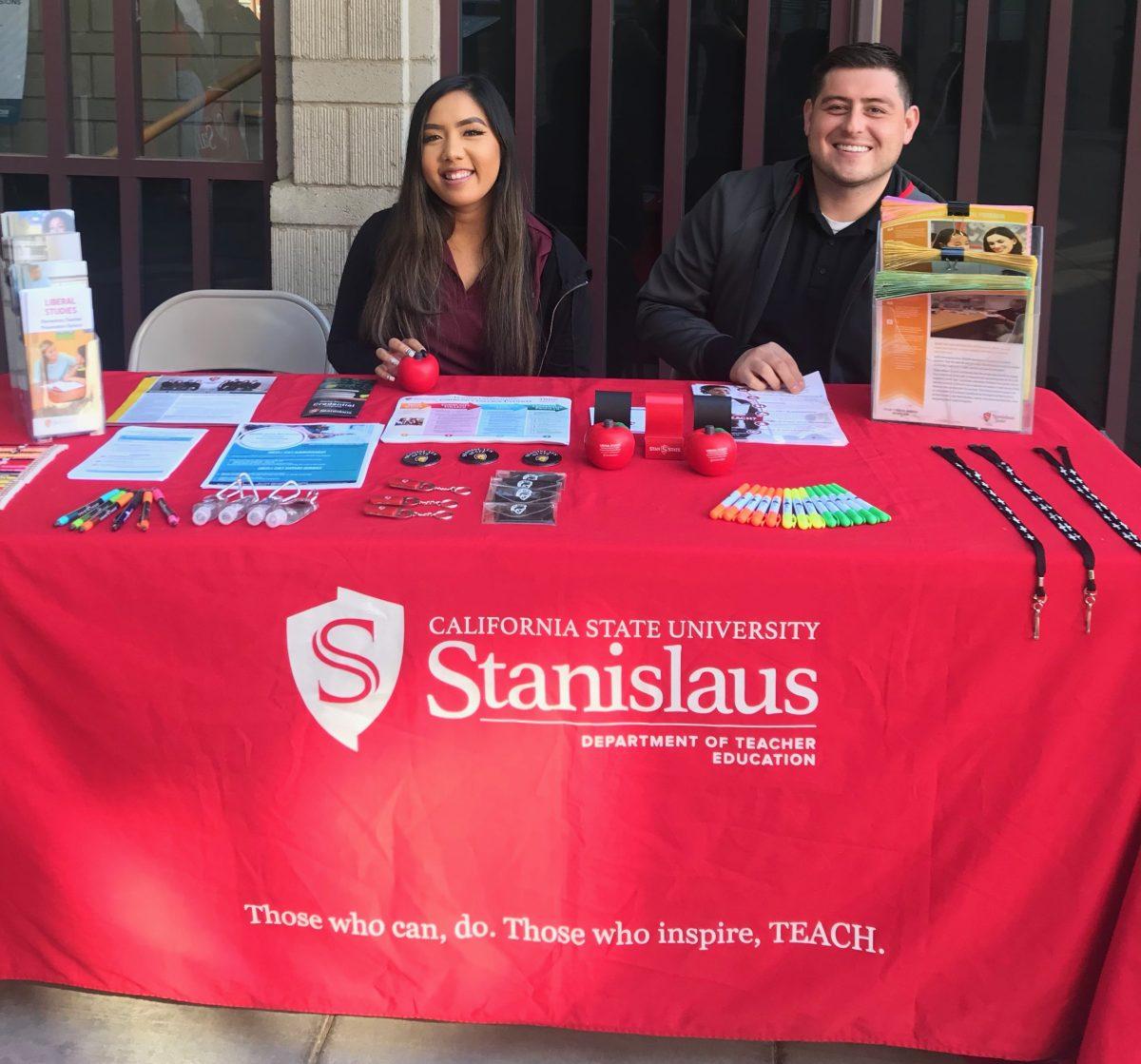 Brenda Dang and Abel Lucero tabling in front of DBH, sharing information about Teacher Education. (Photo courtesy of Lindsey Ouk)