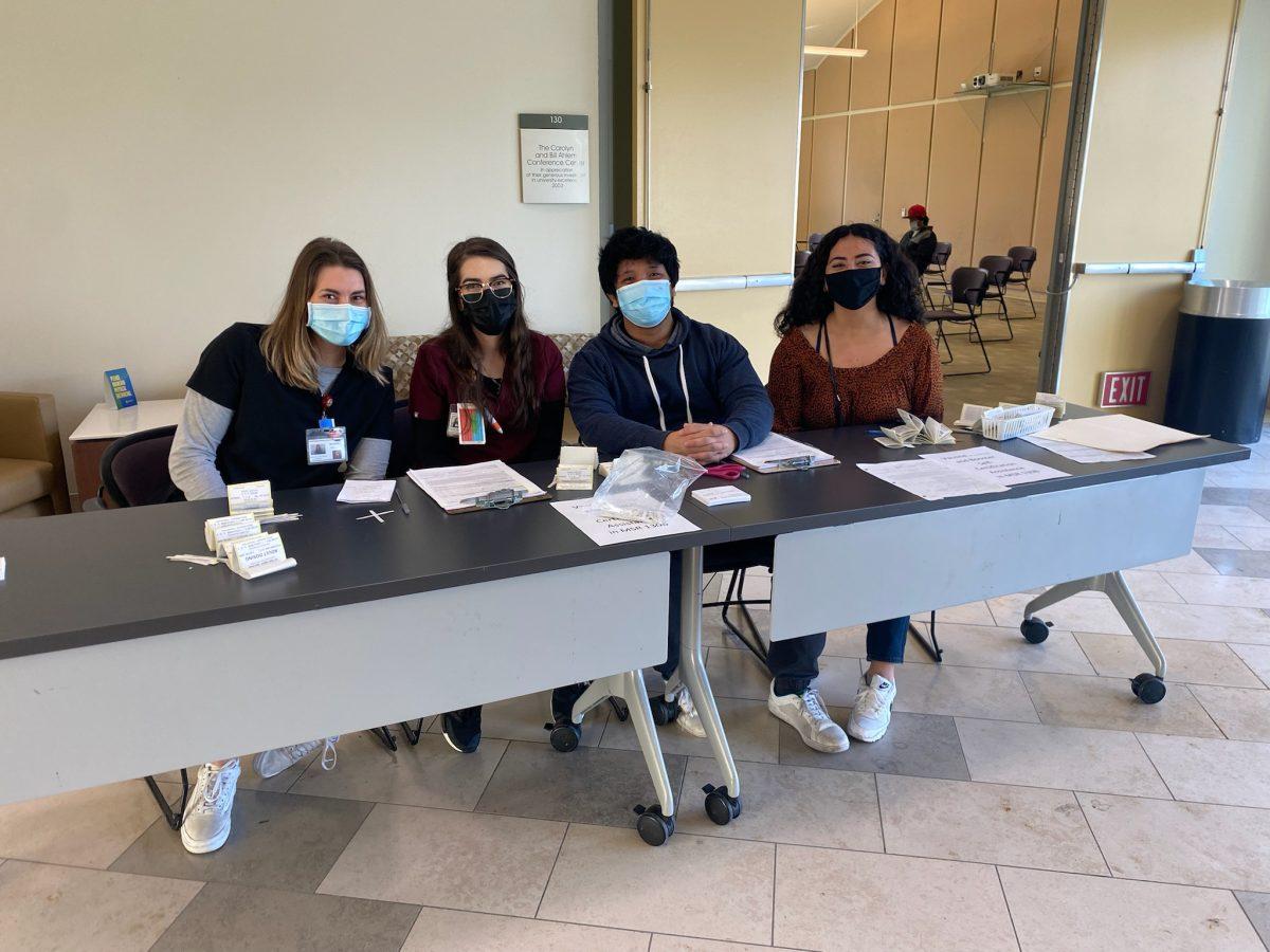 From left to right: Estrella Granados (Safeway employee), Melanie Rosales (nursing student), O'Shaun Melchor (nursning student), and Melissa Nichols (nursing student) worked in conjunction to help get campus community members vaccinated. (Signal Photo/Eduardo Medina)