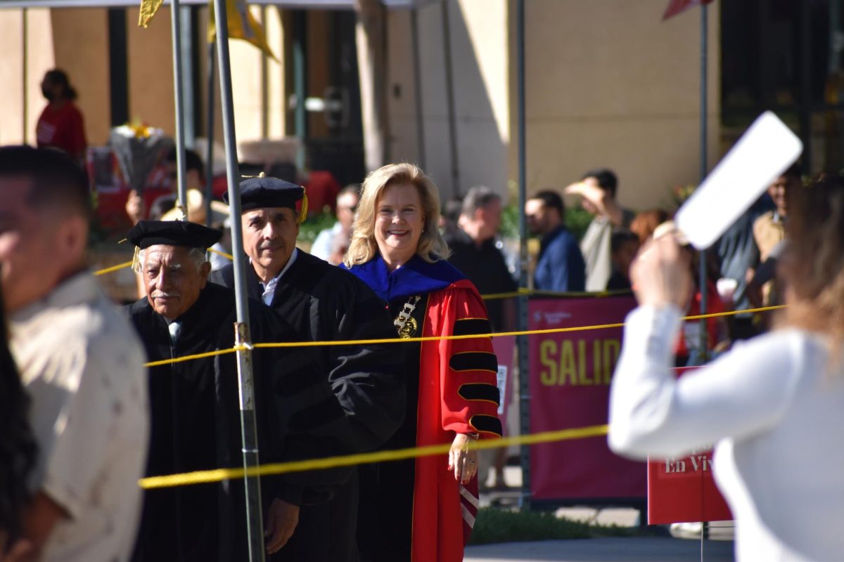 President Britt Rios-Ellis walking into commencement 