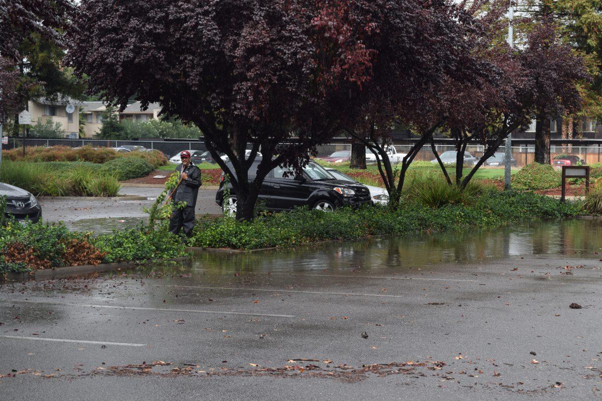 Facility Services taking care of the floods near the Demergasso-Bava Hall parking lots at Stan State on Oct. 28. (The Signal/Jesus Alvarado)