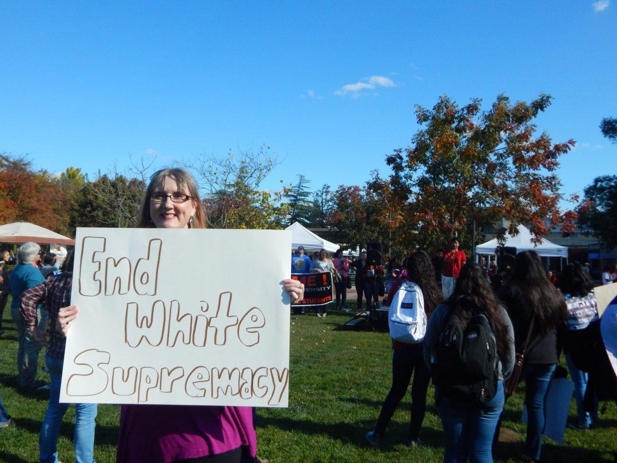 <p>Ann Strahm, Sociology professor, standing amidst the crowd. She passionately participated in every chant, encouraging equality amongst the campus community and the nation.(Signal Photo/ Olivia Soto)</p>