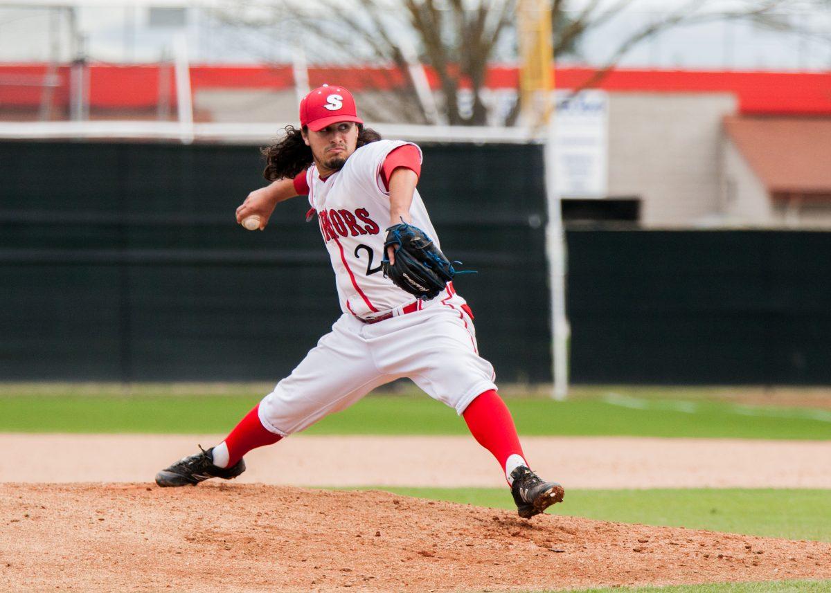 Kron is shown throwing a pitch on the Warrior's mound. (Photo courtesy of Warrior Athletics)