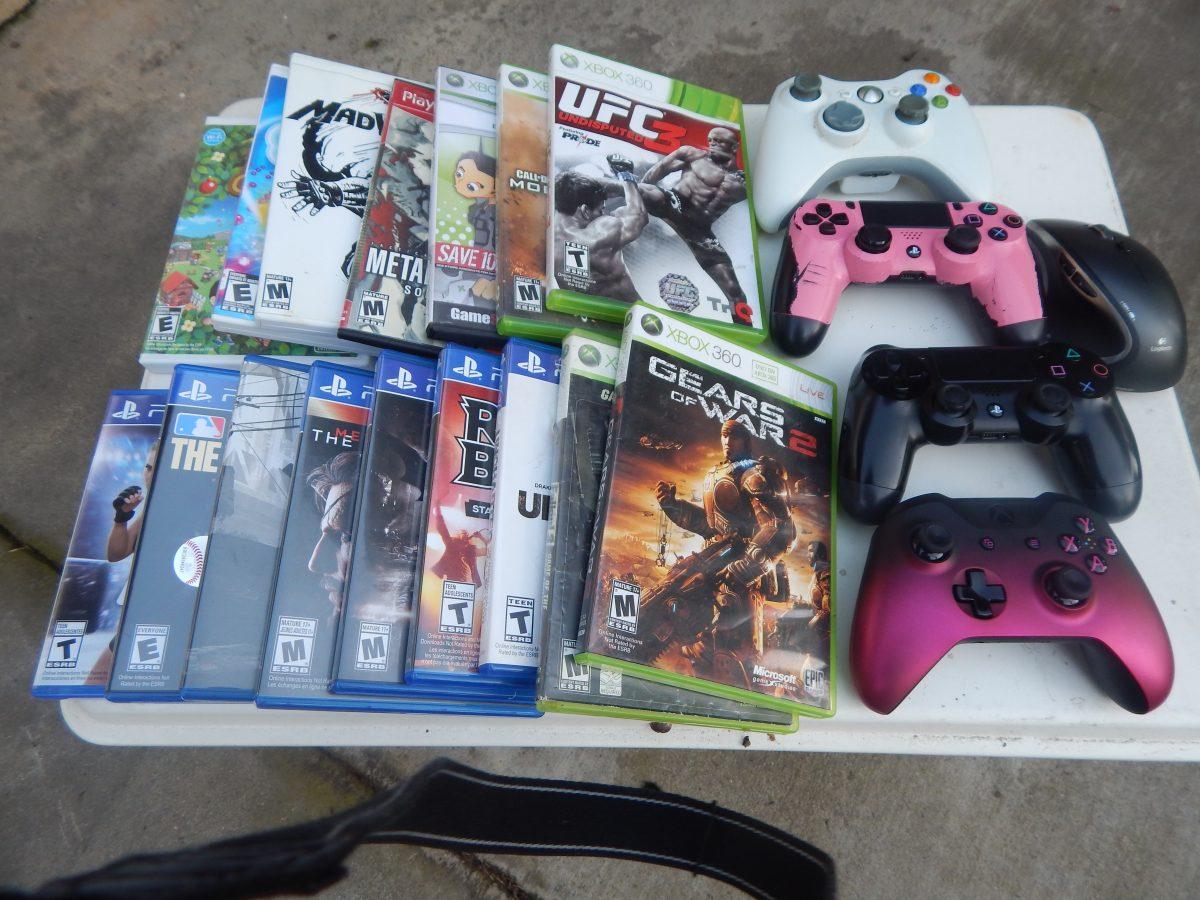 A personal collection of a variety of video games and controllers for the PS4, Xbox 360, Wii, and PlayStation 2, and PC (Signal Photo/Jesus Valdez)