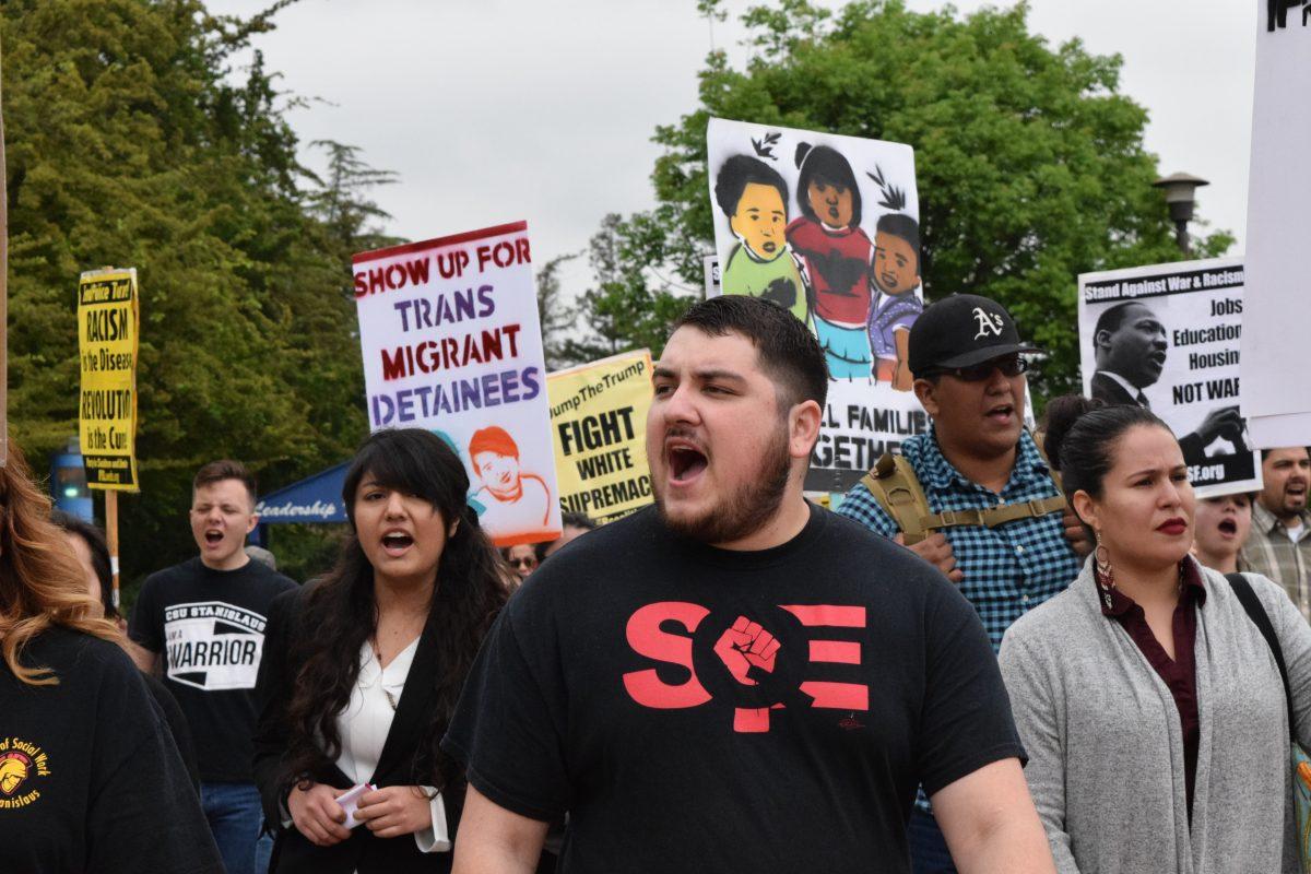 Students and community members marching for the Community Unity Rally on Stan State's quad on Apr. 26, 2017. (Signal Photo/ Steph Landeros)