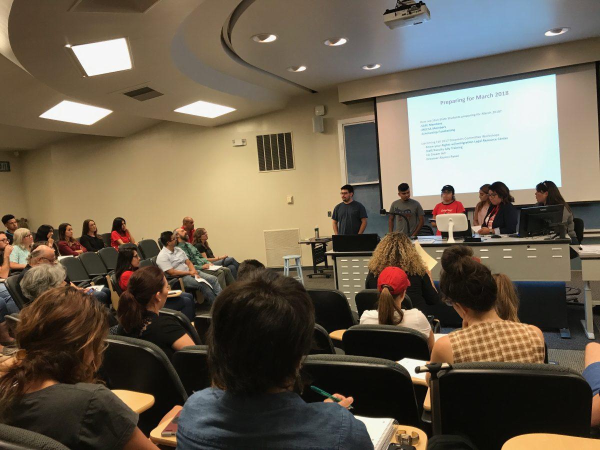 MEChA executive members presenting their current and future plans for supporting the Dreamers community to the forum's attendees in Bizzini 102. (Signal Photo/Jes&#250;s Alvarado)