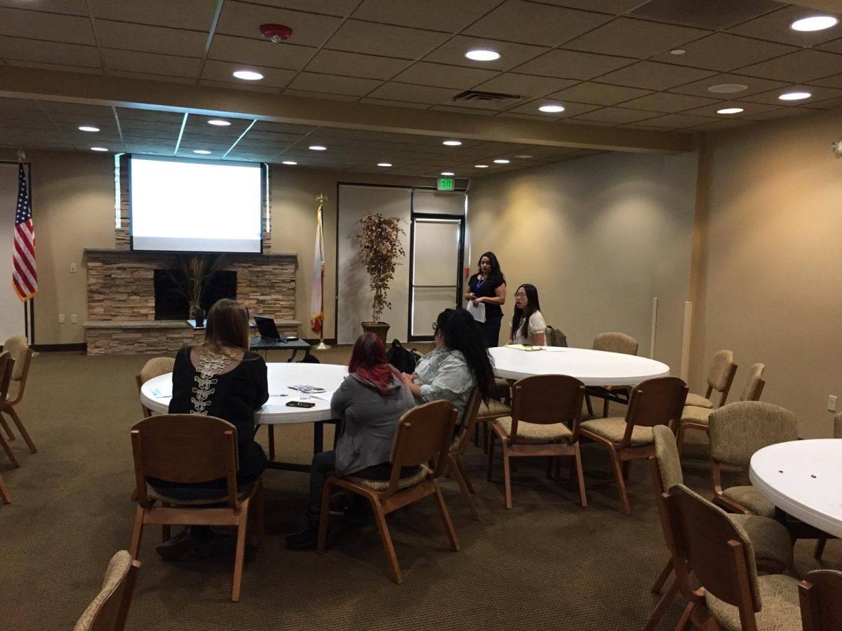 <p>Stan State students regardful as they watch presenter Stacy Vasquez, the Crisis Intervention Advocate for Haven's Women Center, at the Human Trafficking Seminar. (Signal Photo/Gagan Kaur)</p>