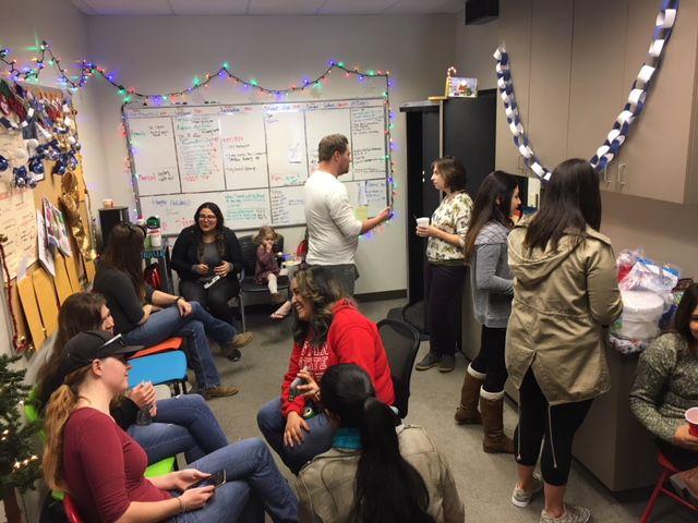 New, returning and graduating members enjoying each other's company and the potluck.&#160;(Photo courtsey of Dr. Shannon Stevens).&#160;