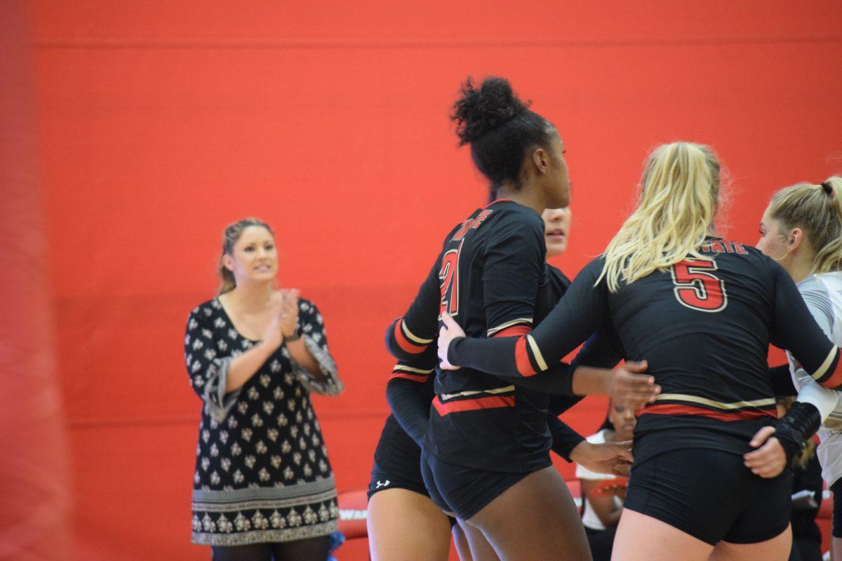 Coach Mallori standing proudly on the sidelines. "On Saturday morning I sent a text to the team which included 10 characteristics of a champion from an article I read. I encouraged them to focus on those leadership qualities as it would help us to be fierce warriors on the court. I believe our team not only read those qualities but also soaked up a deeper meaning of each of those qualities. During several of those moments where the sets were tied or within a couple points of each other, I reminded them of some of those championship behavior words like&#160;fierce, relentless, fearless, tenacious, supportive, competitive.&#160;It kept the focus on things we could control rather than the unpredictable results of our sport."