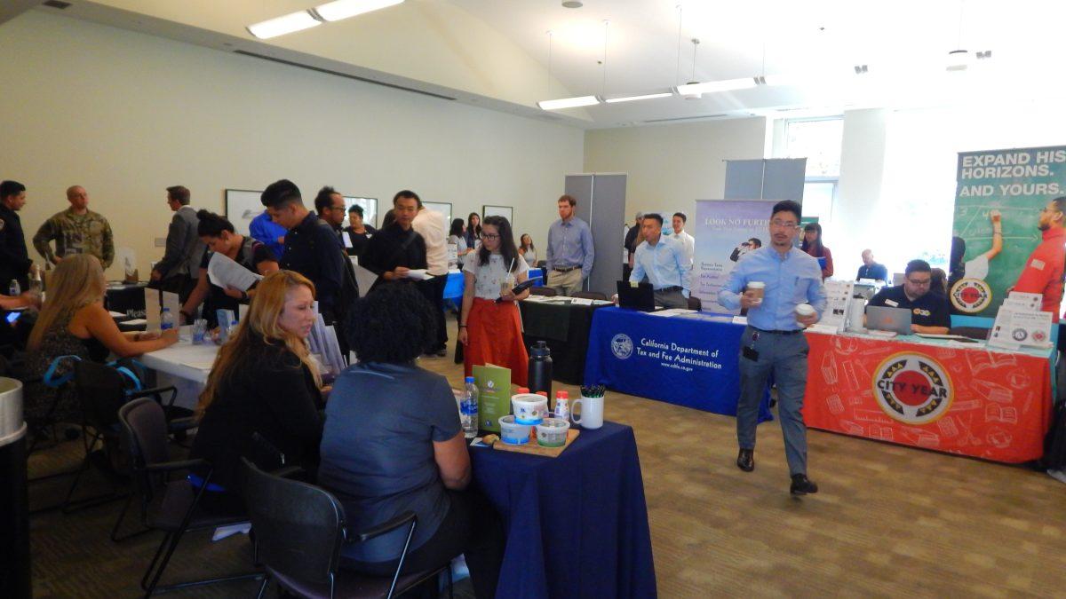 Students walking around the Career Fair Expo seeing future careers after graduation.&#160;