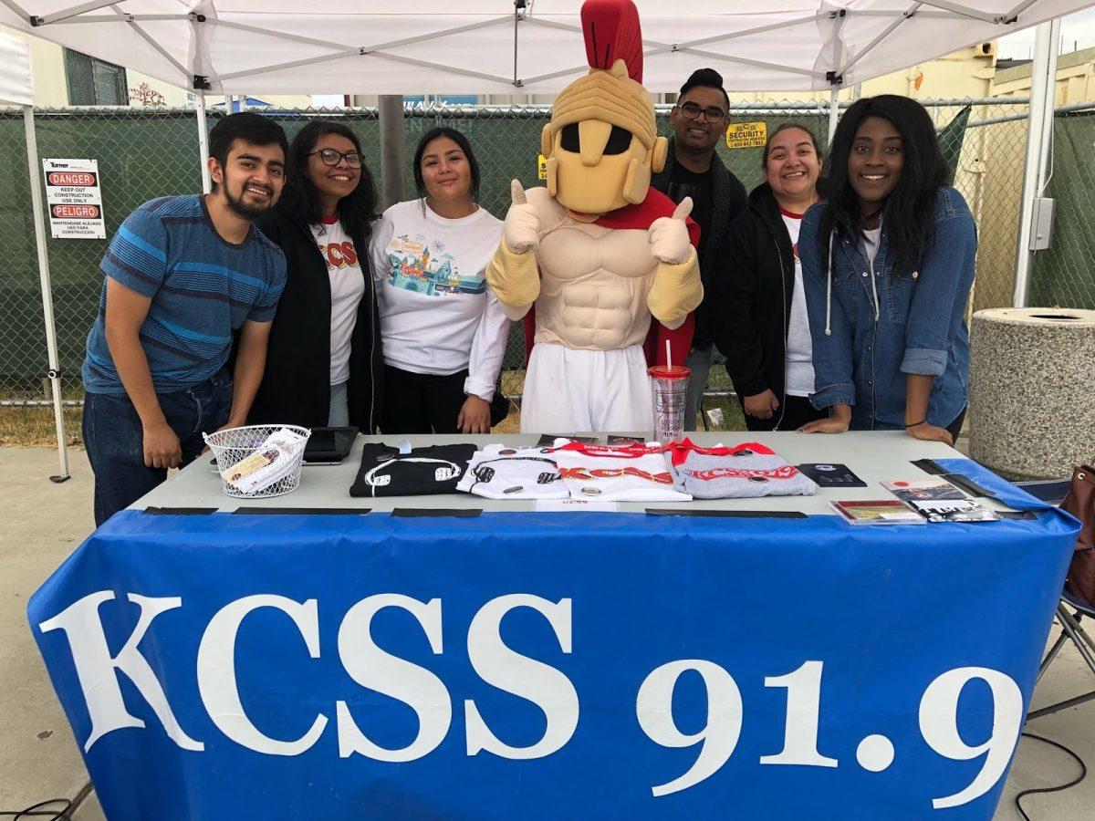 KCSS Staff posing with Titus at their booth during Warior Wednesdays in the quad.