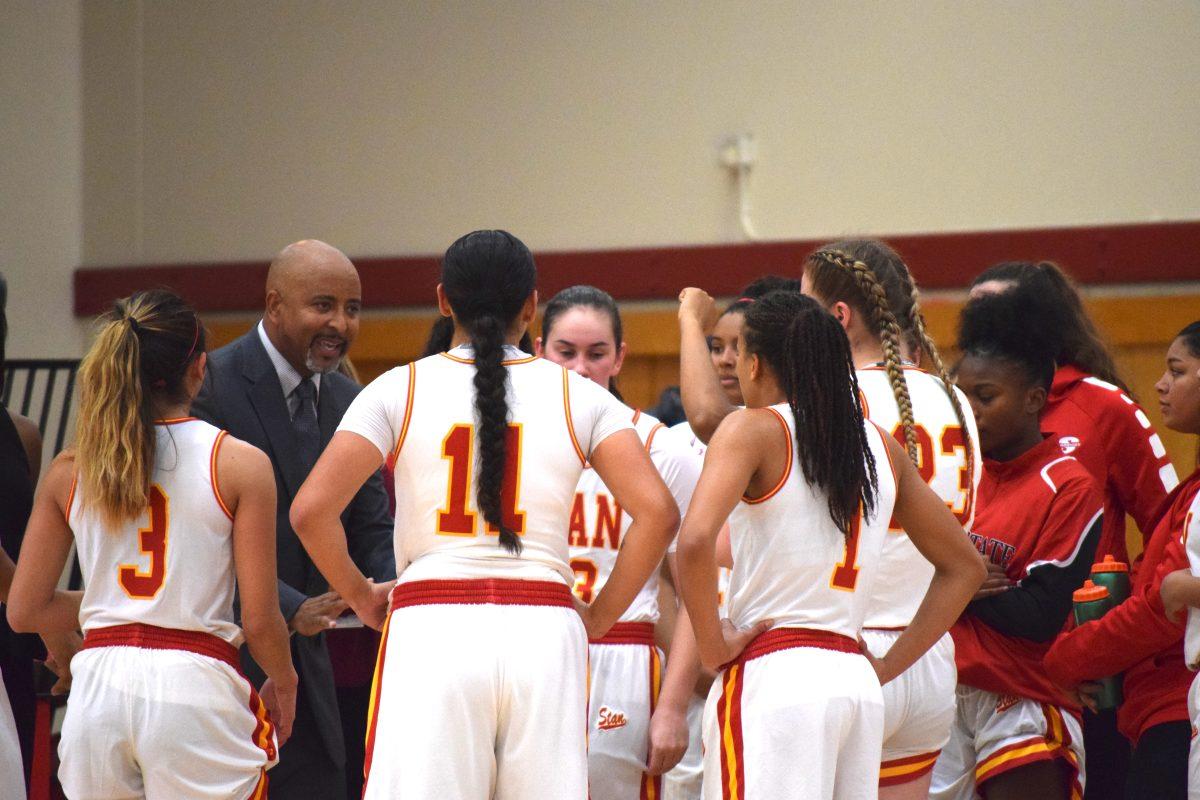 The team gathers around Coach Strickland for adjustments that need to be made in order to ensure victory.