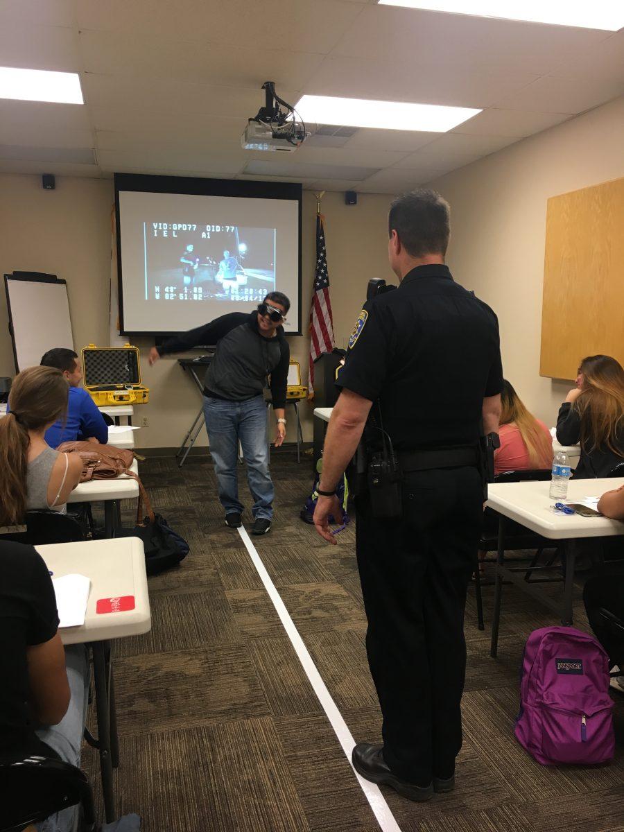 Citizens' Academy participants experience a Field Sobriety Test simulation as one of the activities. (Photo Courtesy of UPD)