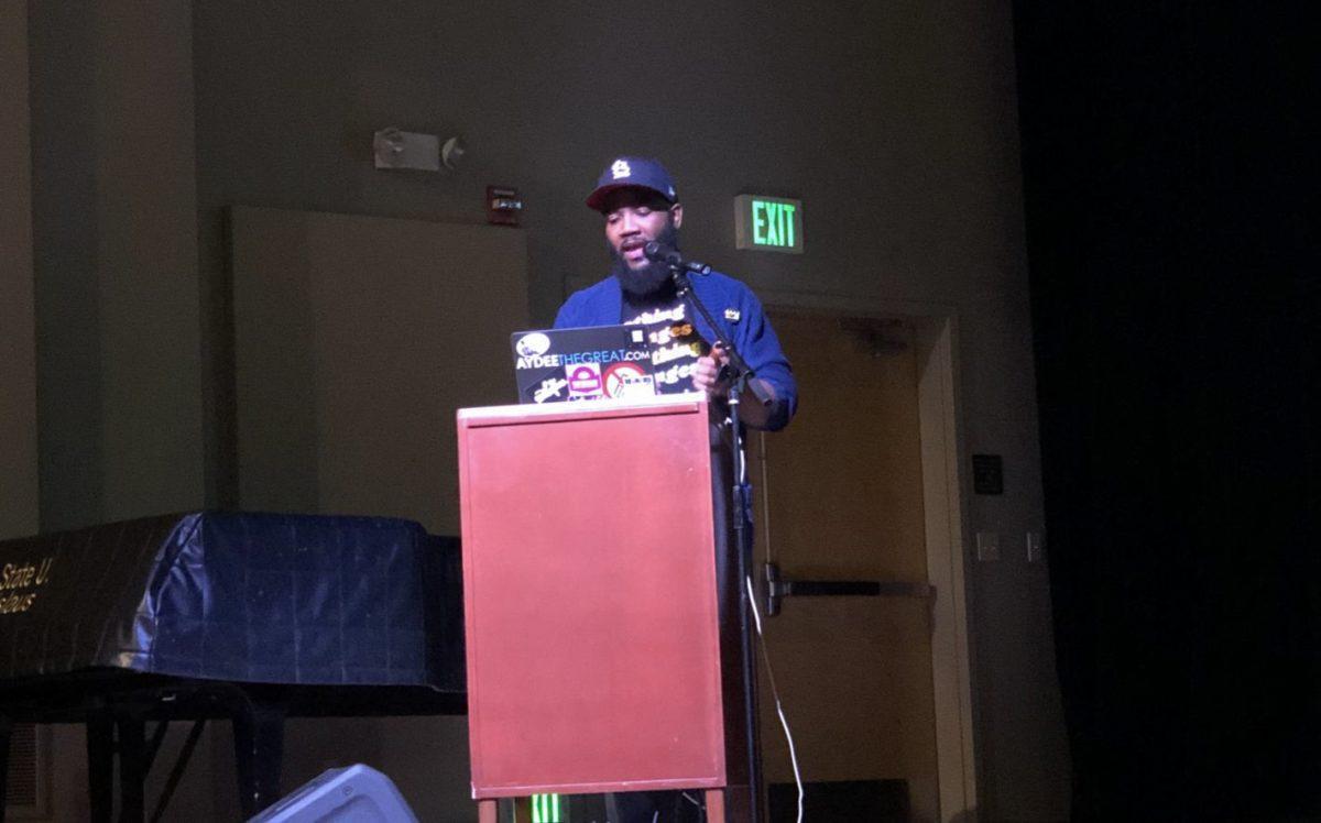 Dr. A.D. Carson addresses the crowd during his performance of "This is the Next Time: Reflections on Resistance Through Rhymes &amp; Revolutions." (Signal Photo/ Harry Harris)