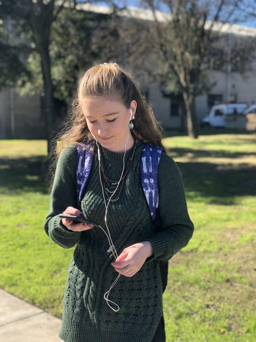 Schuyler Becker, a (freshman English) ponders what song to listen to on her walk to class. (Signal/Harry Harris)