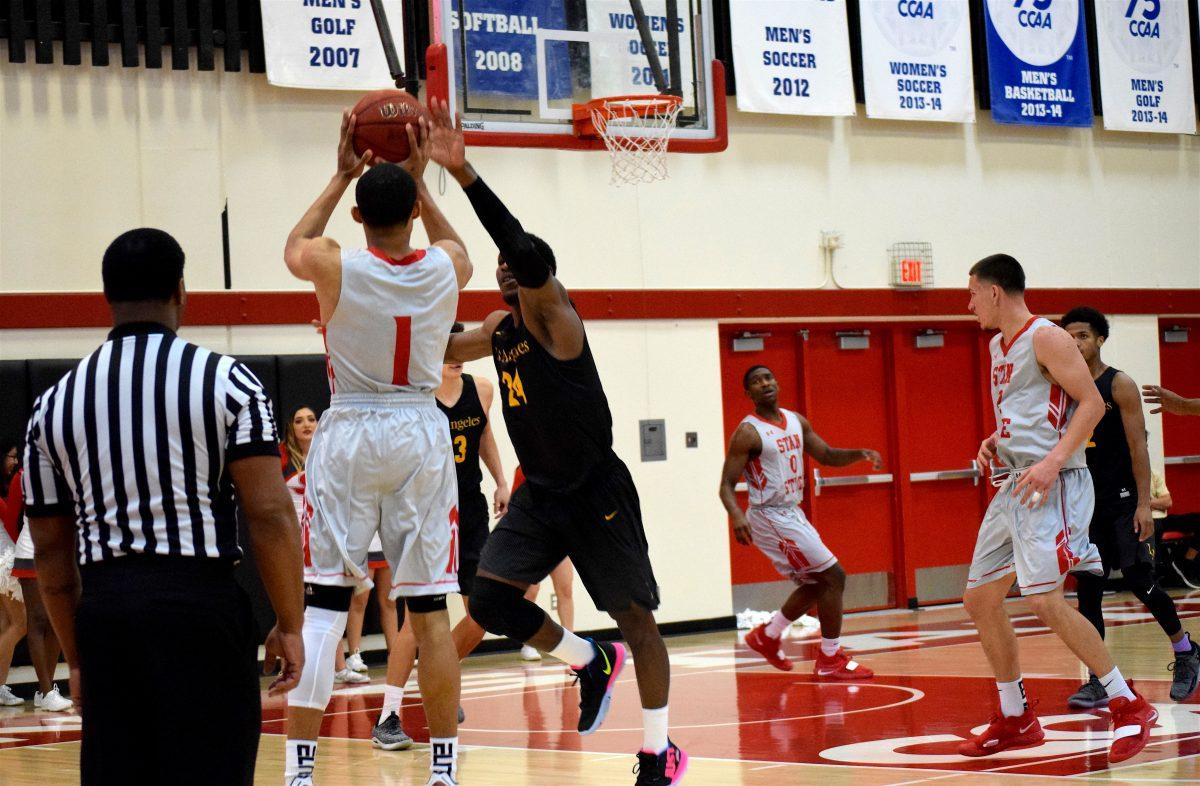 Andy Cleaves (senior, Business Administration) goes up for the three (Signal Photo/Haley Steele)