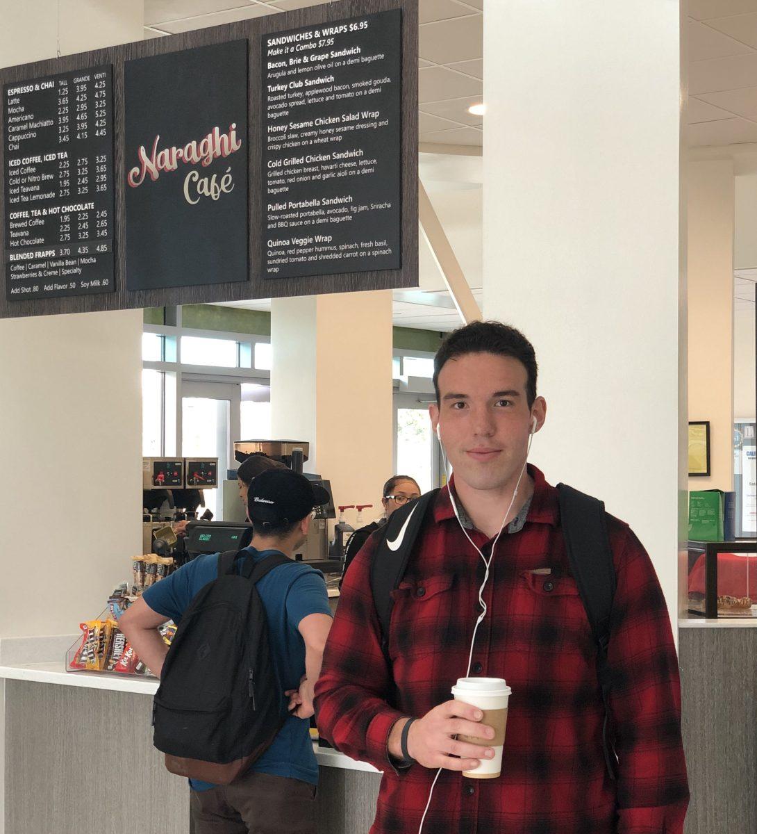 Tristan Jones enjoys his daily coffee from the brand new, Naraghi Cafe. (Signal Photo/ Harry Harris)