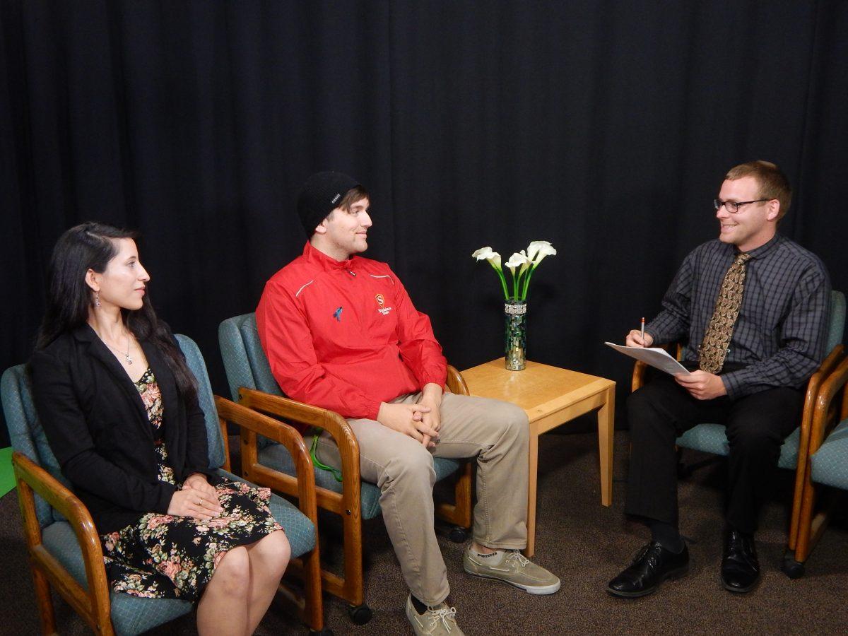 Adam Grabarek interviewing the candidates, Alec Austin and Jessica Roadifer. (Signal Photo/ Kristen Dias)