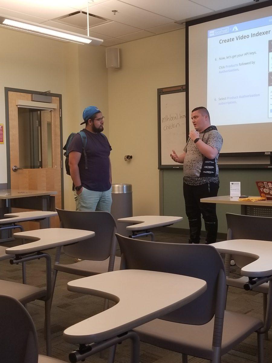 President Austin White (junior, English) talks with a student after his workshop completion. (Signal Photo/Austin Bathke)