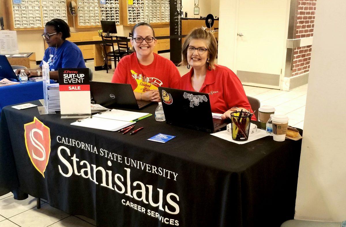 Stan State Career & Professional Development Centers Employer Engagement Coordinator Evelyn Ramos (left) and Recruitment & Career Specialist Rebecca Stephens (right) checking students and alumni into the event. (Signal Photo/Christopher Correa)
