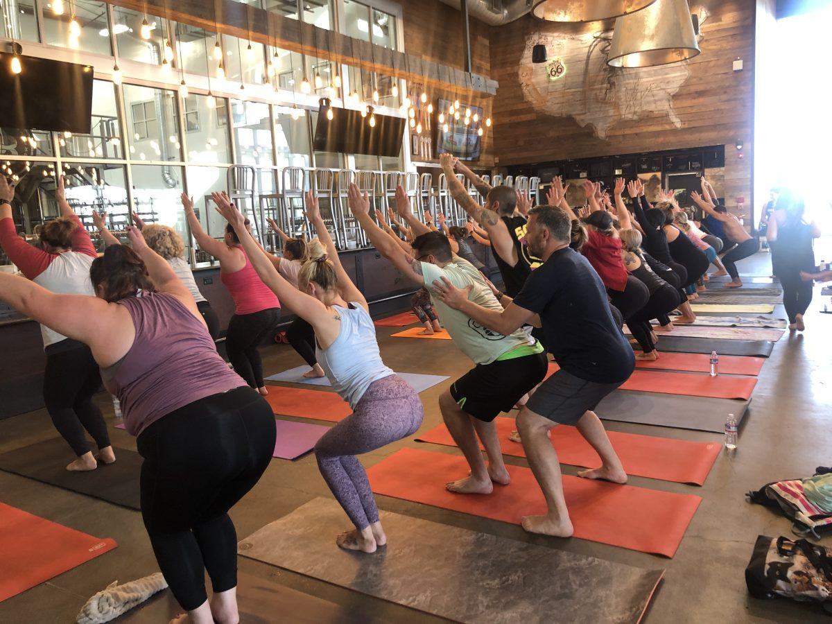 Warrior Yoga teacher helping with poses during instruction.&#160;(Signal&#160;photo/ Aliyah Stoeckl)&#160;