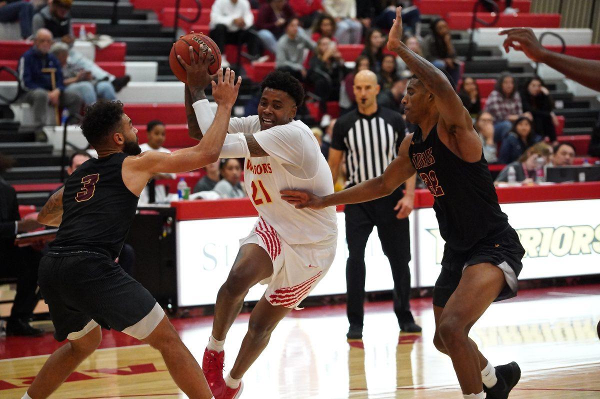 Forward Vida Faniel (senior, Sociology) attempting to create an layup. (Signal Photo/ Randel Montenegro)