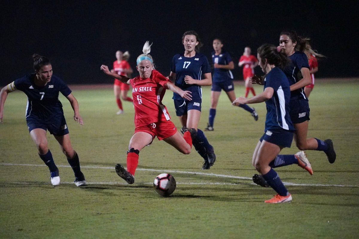 Forward Sadie Ortiz (senior, Kinesiology) successfully attempting a hat-trick scoring another goal for her team. (Signal Photo/ Randel Montenegro)