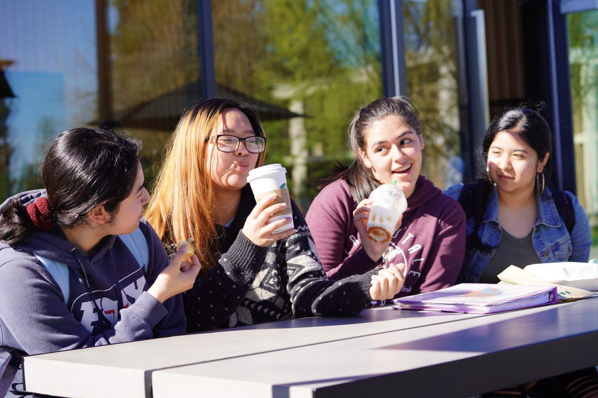 Stan State students Gabriela Rocha (freshman, Kinesiology and Pre-Nursing), Aranza Ocampo Topete (freshman, History), Desteny Madrid (freshman, Criminal justice) and Babie Recinto (freshman, Psychology and Pre-Nursing) enjoying the social atmosphere at the Starbucks. (Signal Photo/ Randel Montenegro)