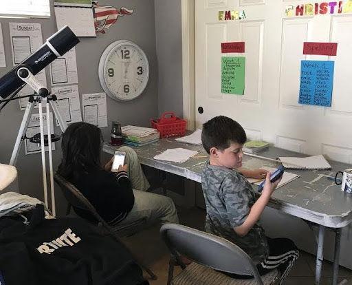 Christian and Emma Silva attending online school from their house. (Photo by Rhonda Silva)