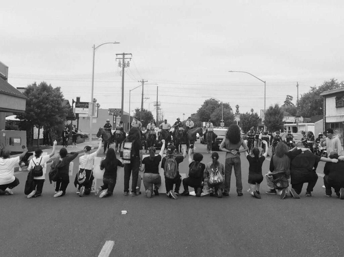 Stand off between protesters and police at the Modesto Protest. (Image courtesy of community member Gerardo Gonzalez)