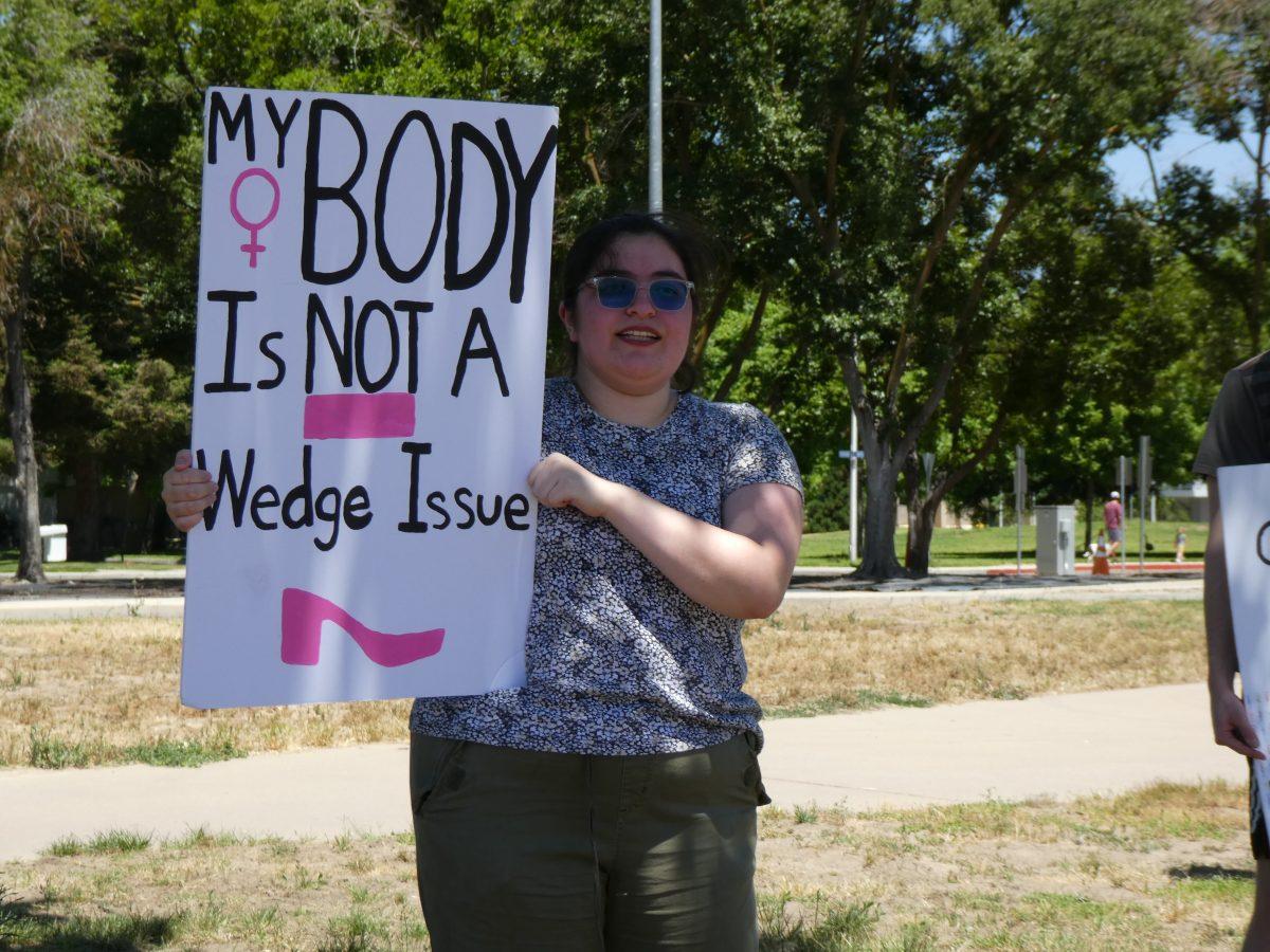 <p>Raquel Bernal Alonzo protesting against the Supreme Court's decision on overturning Roe v. Wade.</p>