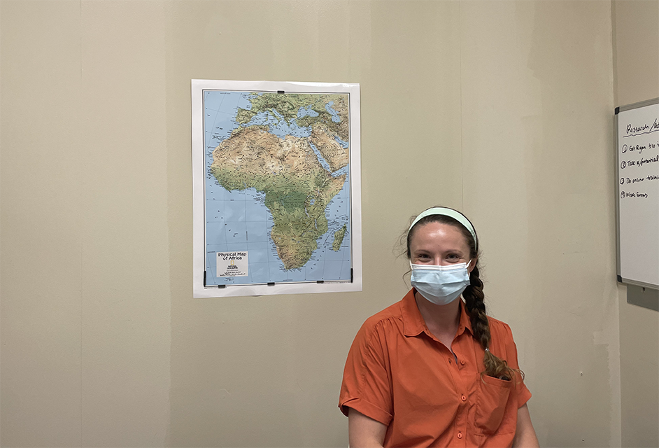 Dr Pazan sits in front of her beloved map of Africa. (Photo by, Alex Byrd)