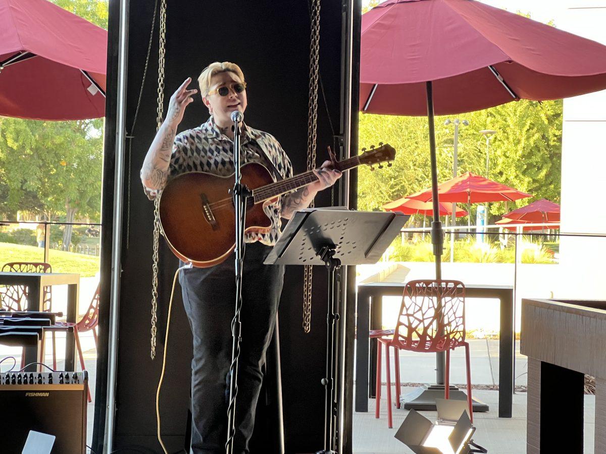 Musician Kayla Just passionately singing at the very first live music event on the Warrior Grill patio. (Photo, Emily Ascencio)