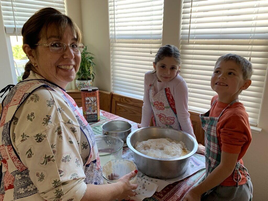 Photo by Kristina Stamper of her mother and children making their favorite Portuguese sweet bread for the holidays. 