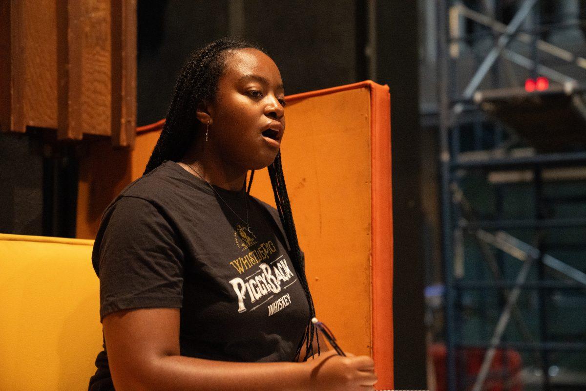 Kiara Taylor singing in tune during music rehearsals. (Signal Photo/Brian Miske)