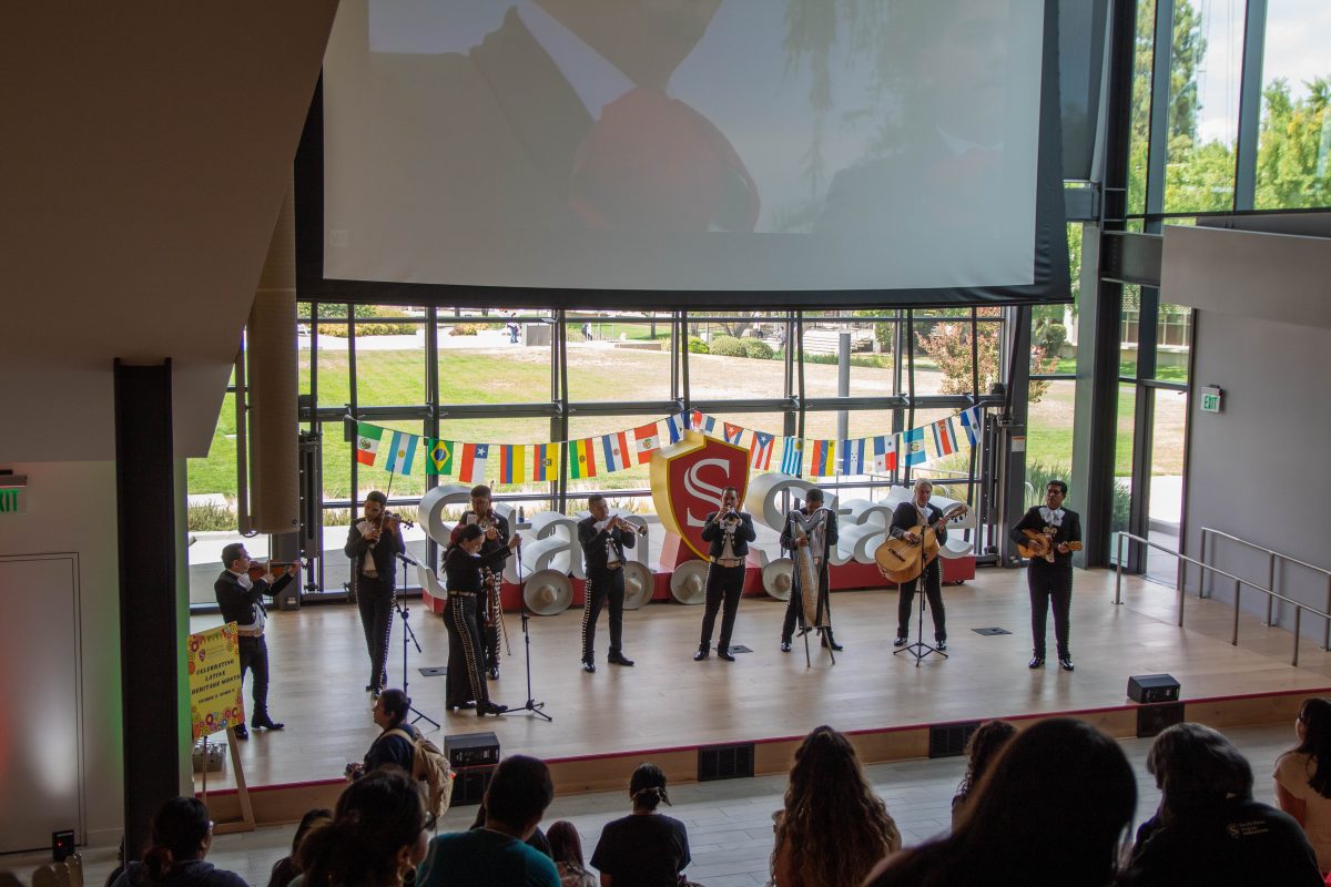 Stan State Mariachi and Mariachi Estelar perform together in front of the Warrior Steps in the Student Center. 